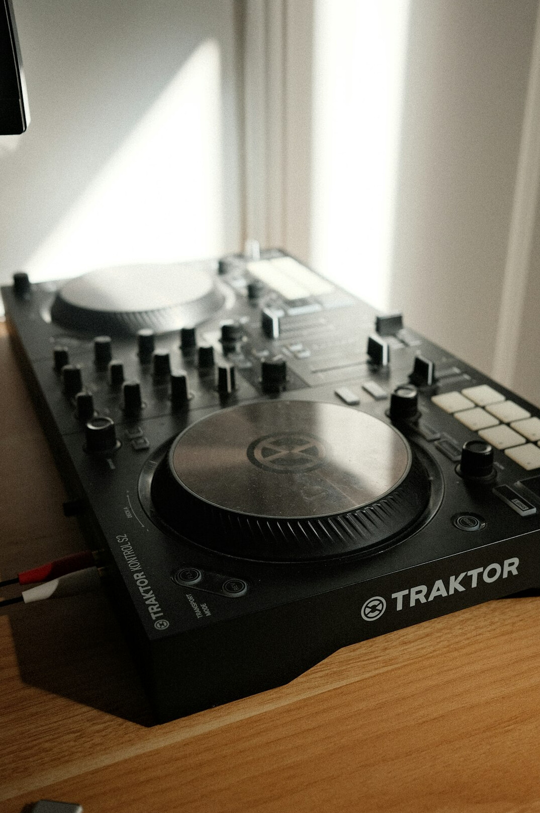 Studio headphones resting on a mixing desk