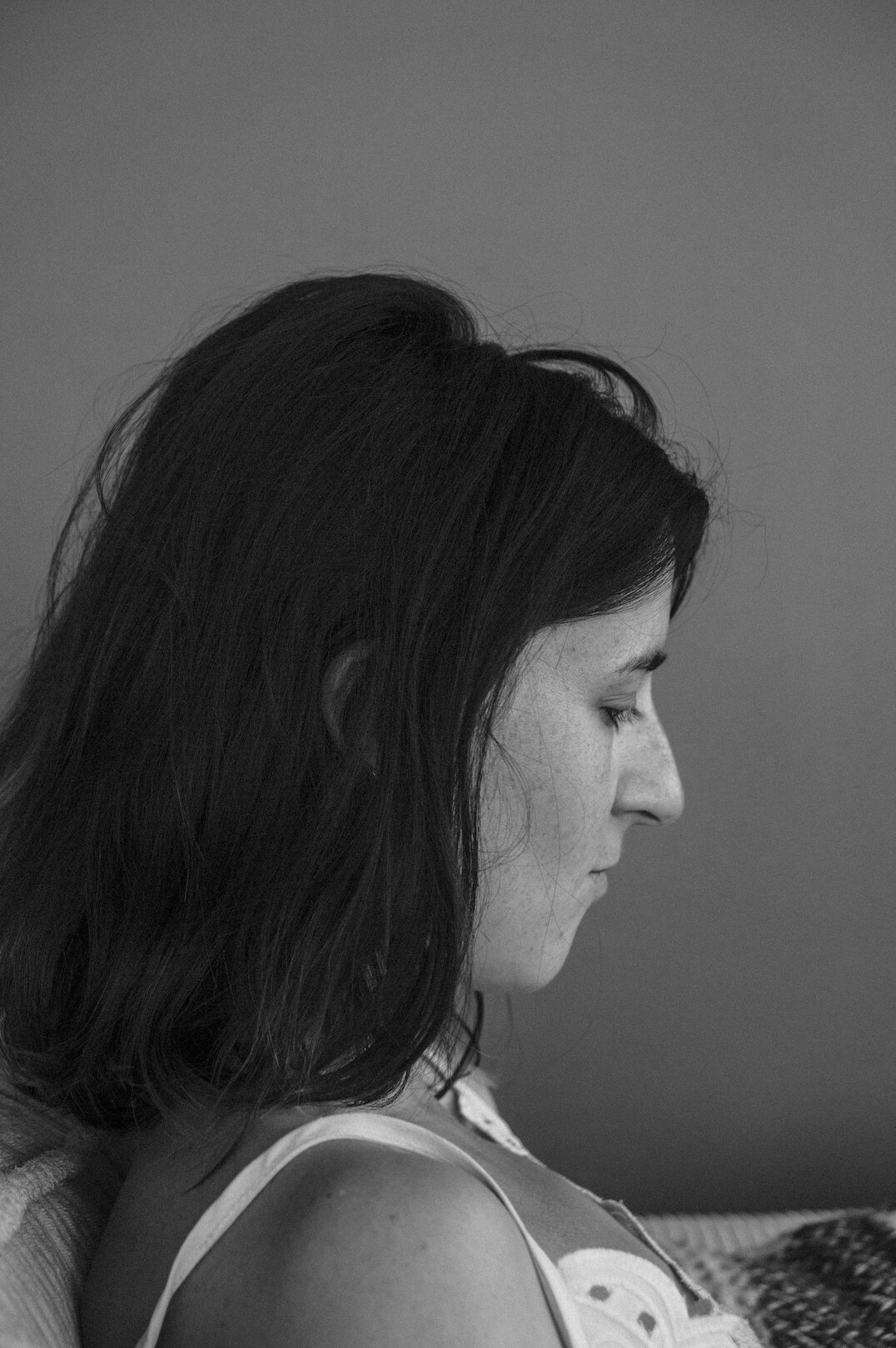 Portrait of a woman with shoulder-length hair smiling
