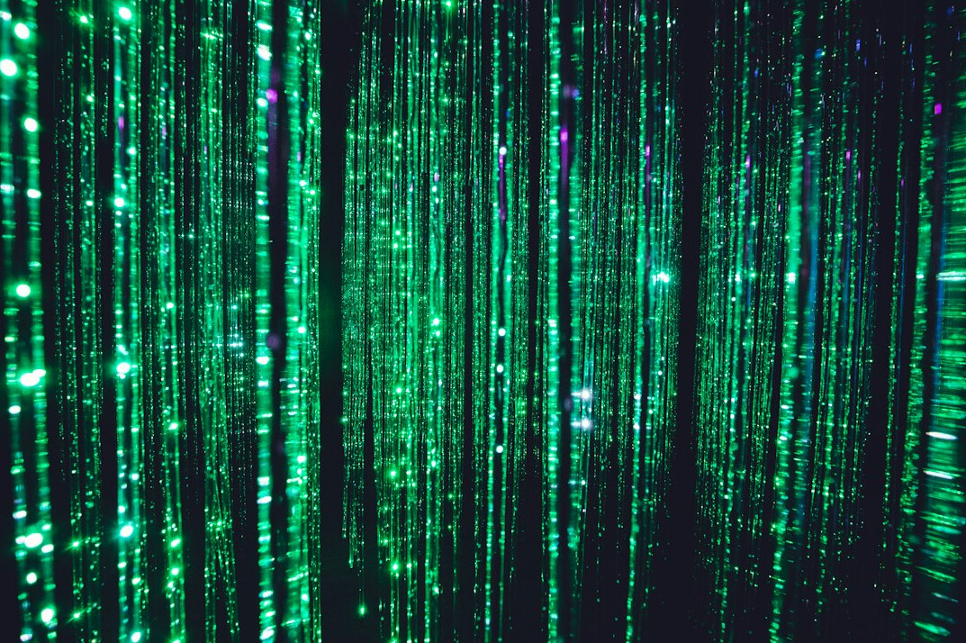 Streams of green code on a dark screen
